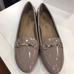 Patent loafer with gold bar. Nude color.